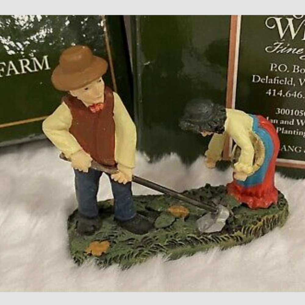 New Lang and Wise Meadowbrook Farm Man and woman planting